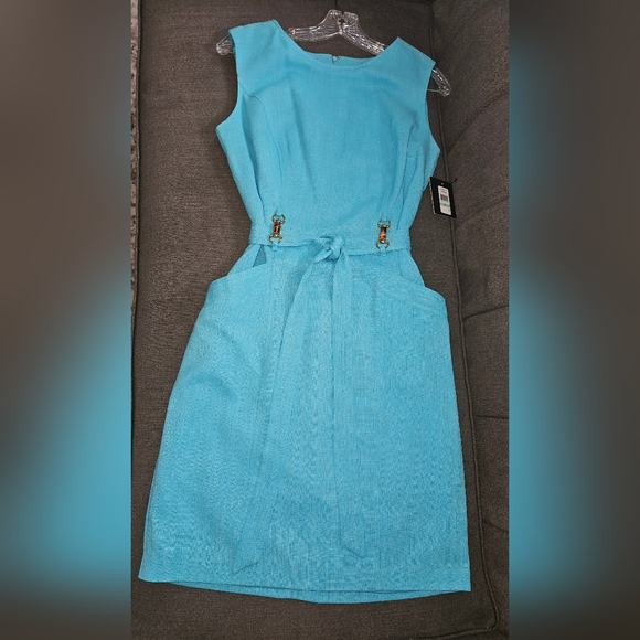 Cocktail length turquoise colored dress. Pockets and belt. Size 8 - Picture 2 of 7